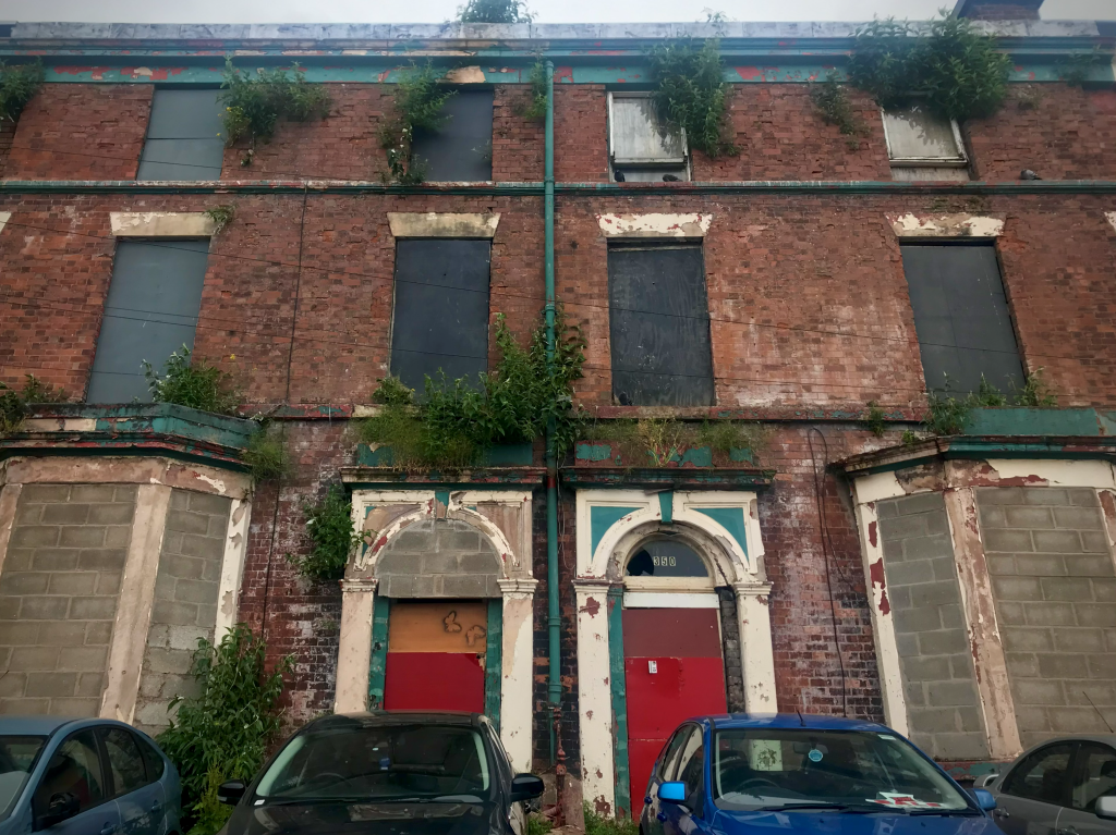 Photograph of a derelict building front in Liverpool, taken 2021. Reference photo for the painting 'Round the corner'.